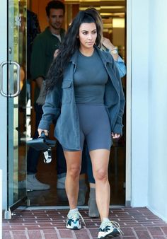 kim kardash is seen leaving the gym in her tight shorts and grey top