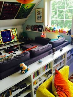 a room filled with lots of books and toys