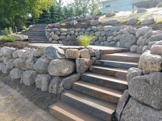 a stone wall with steps leading up to it