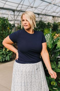 Introducing Jessa in Navy! This stylish top has a lightweight and breathable design, perfect for any occasion. The ribbed texture adds a touch of detail while the short sleeves keep you cool. With its fitted style, Jessa is flattering and comfortable. A must-have addition to your wardrobe! Model is wearing a large and is 5'5". Plus model is wearing an XL and is 5'7". This top is meant to be fitted. This top is paired with the Calla Maxi Skirt. Size Chart Length Bust S 21.5" 34" M 22" 36" L 23" 3 Fitted Ribbed Short Sleeve Top, Fitted Short Sleeve Top With Ribbed Neckline, Ribbed Fitted Top T-shirt For Summer, Summer Ribbed Fitted T-shirt, Casual Ribbed Short Sleeve Fitted Top, Fitted Summer T-shirt With Ribbed Neckline, Stretch Top With Ribbed Neckline And Short Sleeves, Casual Fitted Short Sleeve Top With Ribbed Neckline, Fitted Short Sleeve T-shirt For Spring