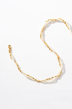 Handwoven with love, this 18K gold pearl necklace boasts luminous pearls delicately entwined within a golden chain. Rock it with your favorite blouse or dress up your LBD – either way, you'll be turning heads wherever you go! Gold Multi-strand Pearl Necklace With Adjustable Chain, Elegant White Beaded Necklace With Chain, Gold Pearl Beaded Necklaces With Chain, Gold Multi-strand Pearl Chain Necklace, White Pearl Chain Necklace Gold-plated, White Delicate Chain Necklace In Gold Plated, White Delicate Chain Necklace For Party, White Multi-strand Beaded Chain Necklace, White Pearl Necklace With Delicate Chain For Party