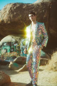 Don't wait until tomorrow and don't look back to yesterday; focus on this moment because the future is now. The Any Old Iron Future Is Now Suit is a fitted blazer and straight-leg ensemble that has been adorned with iridescent, reflective discs of all shapes and sizes. While the mosaic tile design is what brought you here, the suit's other attributes will have you falling in love. Hidden within the blazer, you will find an silky satin interior lining and an interior pocket to house your more int