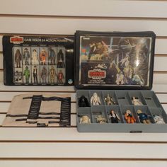 star wars action figures are displayed in an open case