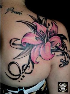 a woman's breast with pink flowers and swirls on the side, in black and white