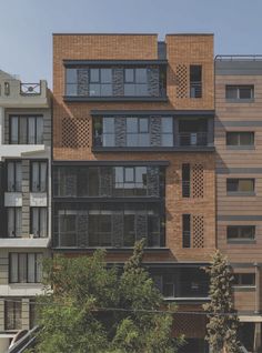 an apartment building with many windows and balconies