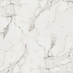 a white marble textured surface with grey veiners