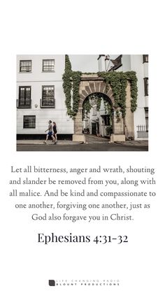 an image of two people walking in front of a building