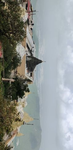 the beach is lined with umbrellas and chairs on it's sides, as seen from above