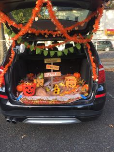 the trunk of a car decorated for halloween