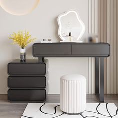 a black and white table with a mirror on it next to a vase filled with flowers