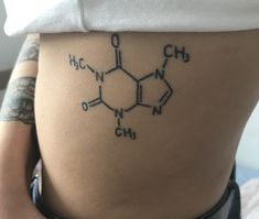 a woman's stomach with the chemical formula tattoo on her lower back and side