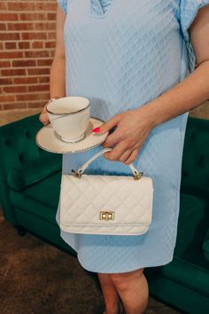 Make a statement with this gorgeous White Quilt Leather Purse! With a luxurious quilted leather exterior and a sleek chain for a crossbody look, this purse is sure to turn heads. Sashay your way to the party in style and comfort! Purse Gift, Chambray Dress, White Quilt, Feminine Dress, Quilted Leather, Leather Purse, Puff Sleeves, Chambray, Leather Purses