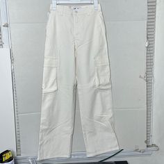 These Are High-Waisted Cargo Pants With A Classic Fit, Slash Hand Pockets And Side Cargo Pockets. They’re Made With Soft-Brushed Cotton Sateen With A Comfortable Touch Of Stretch. Features Zip Fly With Button Closure Back Welt Pockets With Flaps Materials & Care Content: 74% Cotton, 24% Lyocell, 2% Elastane Care: Machine Wash Imported Rise: High Leg: Wider Length: Full Intended To Be A Long Pant And Hit At The Ground While Wearing Heeled Shoes A Size 0 Will Fit Someone Who Typically Wears A Xs I High Waisted Cargo Pants, Cargo Pant, Brushed Cotton, High Leg, Long Pants, Welt Pockets, Color Light, Cargo Pants, Light Colors