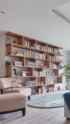 a living room filled with lots of furniture and bookshelves