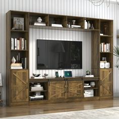 a living room with a large wooden entertainment center