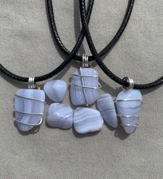 These blue lace agate necklace are meticulously crafted to showcase the natural beauty and uniqueness of the stone, making it a truly one-of-a-kind accessory. The minimalistic design adds a touch of sophistication to any outfit, while the varying shades and patterns of the blue lace agate ensure that each necklace is a unique work of art. Please note that due to the natural variations in the stone, the necklace you receive may vary slightly from the photograph, adding to its charm and individual Blue Lace Agate Necklace, Peaceful Meditation, Crystal Necklaces, Calming Stones, Unique Necklace, Agate Necklace, Blue Lace Agate, Minimalistic Design, Lace Agate