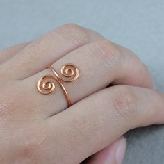 This unique adjustable ring is handmade using heavy gauge Copper wire. Free US shipping, perfect gift for her. ;-) My contact number: 626-379-1904. Please contact me if you would like to order multiples or customize a design for your special event, I will be pleased to give you a discount on a quantity order. ;-) Purchases will be shipped within 1-3 business days. In case of occasional shortage of beads material, purchases will be shipped in a week. Packages are shipped via USPS first-class mail Wire Jewelry Rings, Personalised Gifts Handmade, Spiral Ring, Copper Ring, Wire Rings, Copper Rings, Beaded Material, Creative Jewelry, Gift Handmade