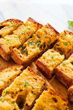 slices of bread on a cutting board with parsley