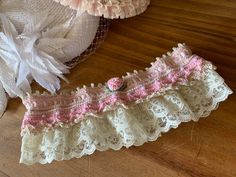 Crochet Bridal garter, crochet wedding garter, heirloom Antique lace crochet garter, Wedding Accessory, Bridal Accessory, Lacy Bridal Garter This wedding garter is another Kristin Holloway design. Her design consists of so many beautiful stitches. This garter is sure to be an heirloom forever. Garter is crocheted with a natural colored size 10 cotton crochet thread and trimmed in a pink orchid colored thread. Several pearls are crocheted into the design which features a number of picot stitches Crochet Garter, Garter Wedding, Orchid Color, Bridal Accessory, Wedding Garters, Crochet Wedding, Wedding Accessory, Pink Orchids, Lace Garter