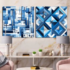 two paintings on the wall in a living room, one is blue and the other is white