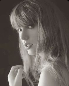 a black and white photo of a woman with long hair