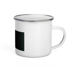 a white and black coffee mug with a silver rim on a white background the cup has a square in the middle