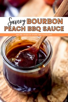 a jar filled with barbecue sauce sitting on top of a wooden cutting board