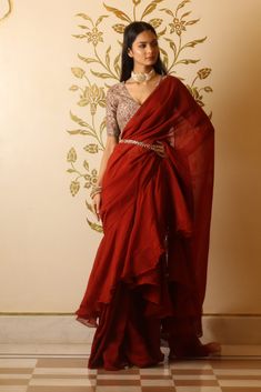 Rustic red organza ruffle saree with chanderi print embroidered blouse. It comes with moti embroidered belt to enhance the look. Organza Ruffle Saree, Indo Western Saree, Pant Saree, Black Embroidered Blouse, Maroon Pants, Mirror Work Blouse, Lehenga Suit, Mirror Work Saree, Ruffle Saree