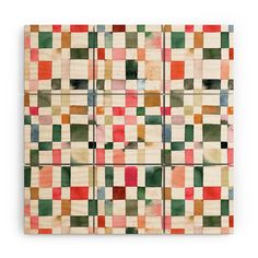 a piece of art that is made out of wood and has different colored squares on it