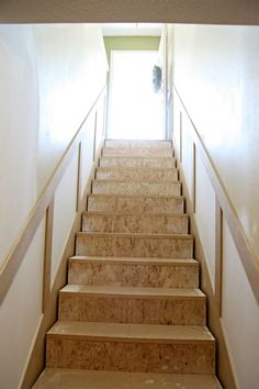 a set of stairs leading up to an open door