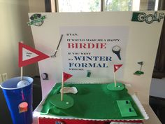 a cake made to look like a golf course with the words, it would make me happy if you went to winter formal