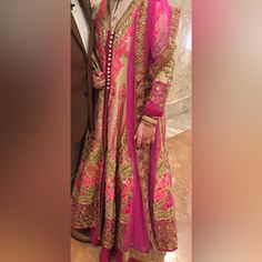 This Beautiful Dress Was Only Worn Once. It Is Heavily Embroidered And Filled With Intricate Bead Work. Get Ready For All The Compliments When You Wear It. It Is Defiantly A Show Stopper. Chest 44, Waist 36, Hips 40, Sleeves 20 But Definitely More Room To Go Up More. Formal Pink Lehenga With Resham Embroidery, Elegant Pink Dress With Zari Work, Formal Pink Lehenga With Intricate Embroidery, Designer Pink Hand Embellished Dress, Elegant Pink Embroidered Lehenga, Traditional Pink Floor-length Dresses, Designer Pink Hand-embellished Dress, Elegant Pink Lehenga For Party, Long Pink Dress With Resham Embroidery