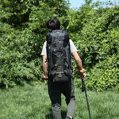 a man with a backpack and walking stick