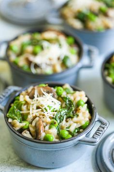 three pots filled with different types of food