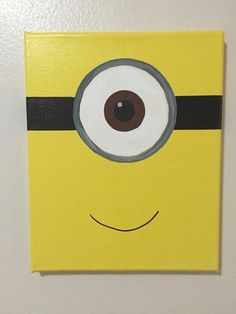 a minion painted on the wall with an eyeball in it's center