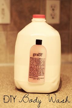 a bottle of grace body wash sitting on top of a counter next to a sink