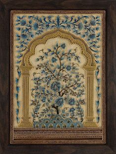 an intricately decorated wall hanging with blue flowers