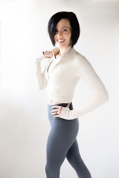 Elevate your activewear collection with the "Wise Jacket," thoughtfully designed to blend style, functionality, and comfort. This figure-flattering semi-crop jacket is your new go-to piece, perfect for a range of activities from vigorous exercise to leisurely fashion statements. Crafted with a high collar to shield you from the elements and integrated thumb holes for added warmth and convenience, the "Wise Jacket" ensures you stay secure and stylish on the move. The anti-skid zipper promises a s Fitted Cropped Activewear For Fall, Versatile Fitted Track Jacket For Winter, Versatile Fitted Winter Track Jacket, High Stretch Versatile Track Jacket, Fitted Half-zip Versatile Outerwear, Versatile Long Sleeve Cropped Jacket For Winter, Versatile Fitted Long Sleeve Track Jacket, Versatile Fitted Outerwear With Thumbholes, Versatile Fitted Half-zip Top