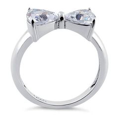 Top of ring height: 7.2mm Top of ring width: 14.8mm Band width: 4mm Shank width: 2.6mm Stone material: clear cubic zirconia Stone shape: heart cut Total number of CZ stones: 2 Stone setting: prong setting Metal: 925 sterling silver Plating: rhodium plated Finish: high polish Stone Material, Silver Bow, Stone Setting, Cz Ring, Sterling Silver Heart, Cz Stone, Stone Settings, Rhodium Plated, Prong Setting