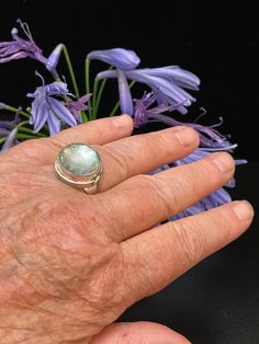 Aquamarine Cabochon and Sterling Silver Ring. Named After the - Etsy Unique Blue Moonstone Ring, Blue Round Cabochons For Anniversary, Handmade Ocean-inspired Rings, Unique Blue Moonstone Cabochon Ring, Unique Blue Cabochon Moonstone Ring, Blue Larimar Moonstone Ring, Unique Turquoise Moonstone Ring, Blue Moonstone Cabochon Ring, Aquamarine Cabochon