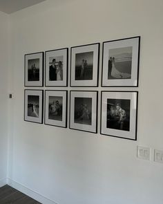 black and white photographs hanging on the wall