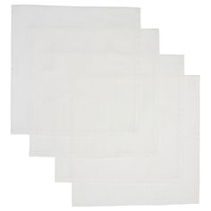 four white linen napkins on a white background