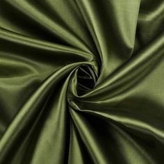 a close up view of a green satin fabric