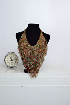 Unique African Maasai Handcrafted Beaded Necklace with an Elegant Look and Brilliant Finish. Circumference = 16 Inches/ 41 Centimeters. Color =Multi-Color Maasai Beads. Fringe = 10 Inches / 26 Centimeters. **GET FREE SHIPPING FOR ADDITIONAL ITEMS PURCHASED. Yes, Buy Multiple Items and pay shipping for 1 item only- The rest ships Free. (No Limits on the number of Multiple items). With a faster delivery time of 3 days via DHLExpress, Worldwide. Ordinary/Standard Shipping also available upon reques Artisan Multicolor Long Beaded Necklace, Traditional Multicolor Beaded Fringe Necklaces, Traditional Multicolor Beaded Necklaces With Fringe, Traditional Multicolor Beaded Necklace With Fringe, Traditional Multicolor Jewelry With Beaded Fringe, Artisan Multicolor Multi-strand Beaded Necklaces, Artisan Multicolor Beaded Chain Necklace, Artisan Multicolor Multi-strand Beads, Unique Multicolor Long Beaded Necklace