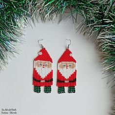 Christmas Santa beaded earrings, Winter earrings, Long seed bead earrings, Holiday Santa Claus fringe earrings.   Size: Length, beadwork part - 7.4 cm (2.9'') Width - 3 сm (1,2'')  Materials: Stainless steel ear hooks Czech glass beads Nylon Thread Silicone plugs .. ready to be given away! Contact me if you have any questions. I will be happy to answer :) Please note that due to lighting effects, monitor's brightness, contrast and other settings, there might be some slight differences in the col Long Seed Bead Earrings, Earring Styles, Winter Earrings, Earrings Long, Seed Bead Earrings, Fringe Earrings, Bead Earrings, Bead Designs, Christmas Santa