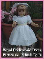 the doll is wearing a white dress and headband, with pink flowers in the background