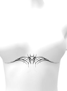 the back of a woman's bra with spider web tattoos on her chest and shoulder