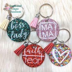 four key chains with different designs on them