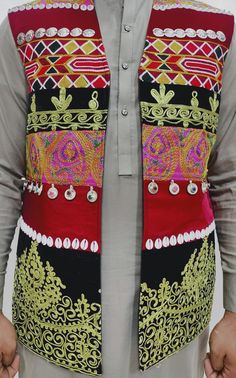 Here is an Afghan Kuchi Pashtun men handmade zari  silver embroidery work vest waistcoat. Traditionally such vests are used on special events like wedding Nikah and Mehndi event. Available in small, medium and large size. It contains very beautiful golden color threads embroidery work which is traditionally called "Zari or Tilai" embroidery work. Fabric is long lasting, comfortable and breathable. Festive Bohemian Vest With Intricate Embroidery, Traditional Sleeveless Vest For Festive Occasions, Traditional Sleeveless Festive Vest, Festive Vest With Multicolor Embroidery, Festive Embroidered Vest With Multicolor Embroidery, Festive Embroidered Multicolored Vest, Traditional Sleeveless Vest With Resham Embroidery, Traditional Embroidered Festive Vest, Traditional Wedding Vest For Festive Occasions