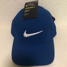 Nike Golf Hat. Medium Blue. Structured Front Along Forehead. One Size. 2 Available. Blue Sporty Baseball Cap, One Size Fits Most, Sporty Blue Baseball Cap, One Size Fits Most, Sporty Blue Baseball Cap One Size, Sporty Blue Baseball Cap One Size Fits Most, Sporty Blue Six-panel Baseball Cap, Nike Sports Hat One Size, Blue Sports Hat, Blue Sporty Baseball Cap For Sports, Blue Sporty Baseball Cap